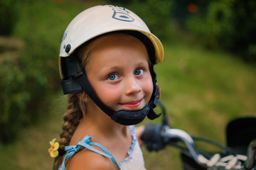 cute little girl in a helmet close. vacation concept. safety concept