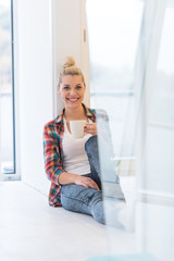 Wall Mural - Portrait of a beautiful girl on the floor