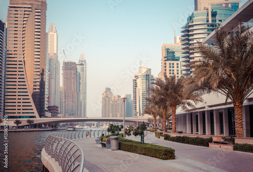 Obraz Dibond Panoramic view on downtown and promenade in Dubai Marina with modern high skyscrapers. Architecture and constructions of future. Famous tourist destination