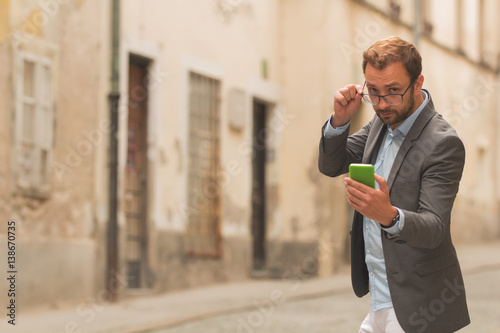 Fotomural Business modern guy using cellphone.