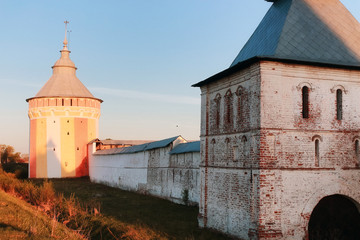 Wall Mural - Brick cathedral fortress medieval Christian era at sunset