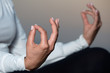 © pavel1964 - Yoga woman meditating and making a zen symbol with her hand