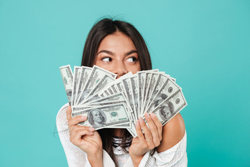 Poster - Pretty happy young woman holding money.