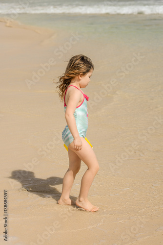 Enfant Jouant Sur La Plage Ensoleillée Buy This Stock