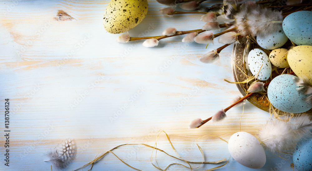 Easter background with Easter eggs and spring flowers. Top view with ...