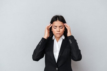 Wall Mural - Young Business woman having headache