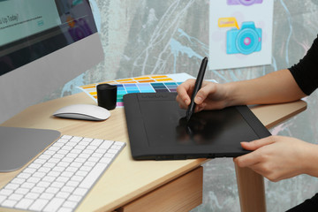 Poster - Young designer drawing sketches on graphic tablet