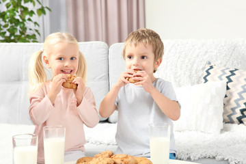 Wall Mural - Little kids eating cookies at home