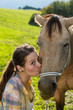 Portrait of a girl with a brown horse in Slovakia