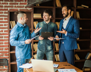 friendly business team discussing financial documents near the w