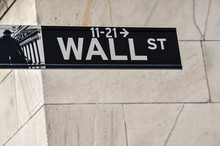 Wall Street Sign With Tiled Building In New York City