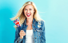 Happy Young Woman Holding Union Jack Flag
