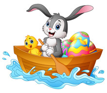 Easter Bunny Rowing Boat With Chicks And Decorated Easter Eggs