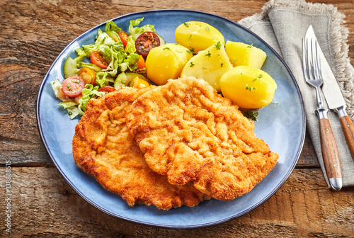 Served schnitzel dish from above Stock Photo | Adobe Stock