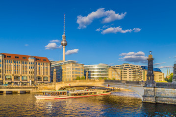 Fototapete - Berlin city center with ship on Spree river at sunset in summer, Germany