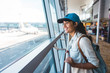© Justin - Young woman at airport waiting for airplane