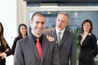 © Minerva Studio - Businessman congratulating with an employee