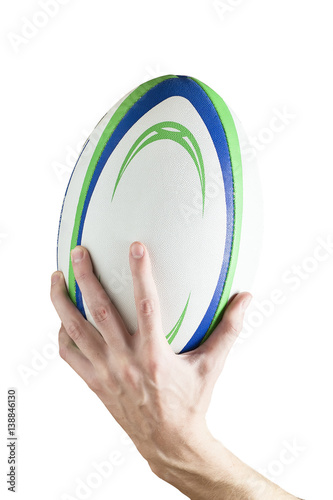 Zdjęcie XXL Rugby piłka w ręce mężczyzny. Pojedynczo na białym tle