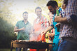 © NDABCREATIVITY - Happy friends enjoying barbecue party