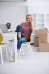 Wall Mural - Young woman moving in a new home