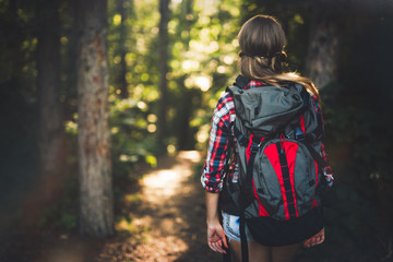 Wall Mural - pretty woman hiking in forest