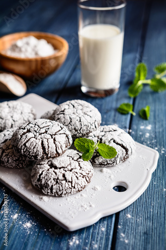 Fotografia, Obraz Chocolate crinkle cookies with powdered sugar icing