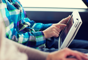 Sticker - close up of boy with tablet pc in travel bus