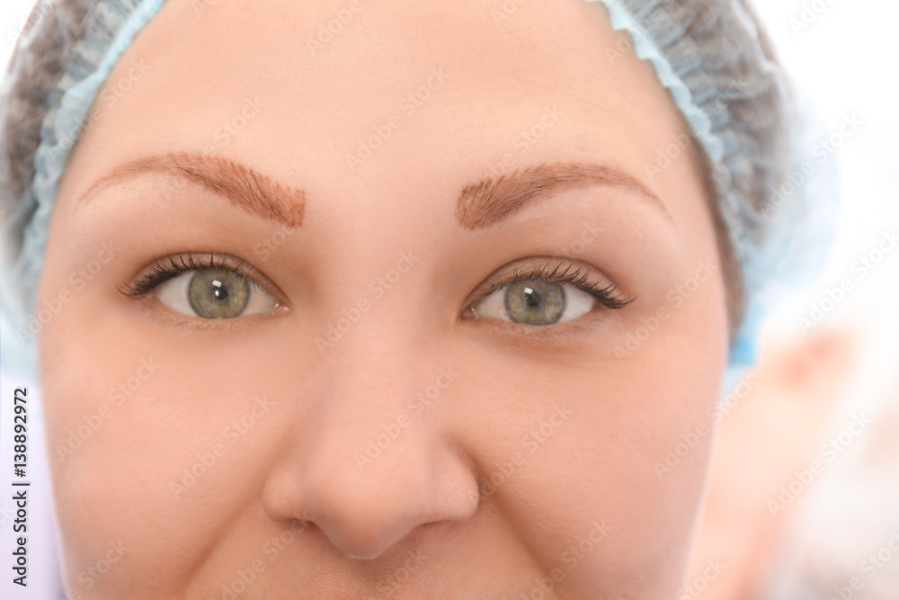 Woman in process of eyebrow tattoo removal
