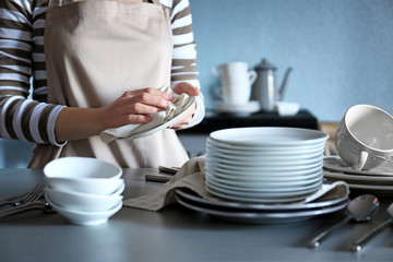 Canvas Print - Closeup of female hands cleaning saucer