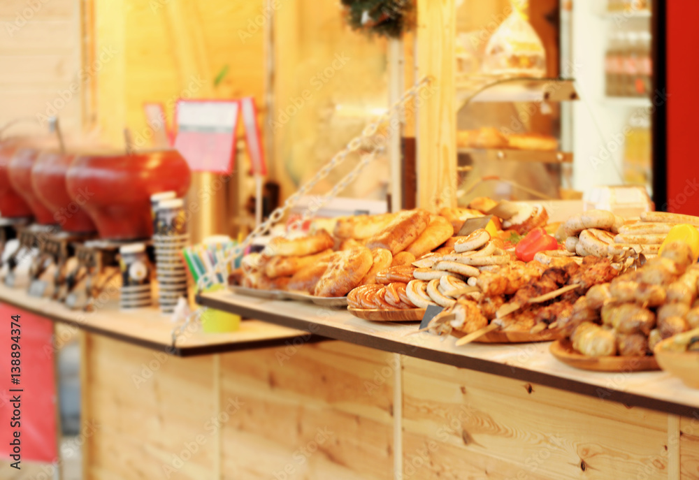 Trays with tasty food on counter