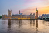 Fototapeta Big Ben - Houses of Parliament from across the River Thames at dusk. Part of Westminster Bridge can be seen