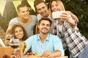 Sticker - Friends taking selfie during barbecue picnic