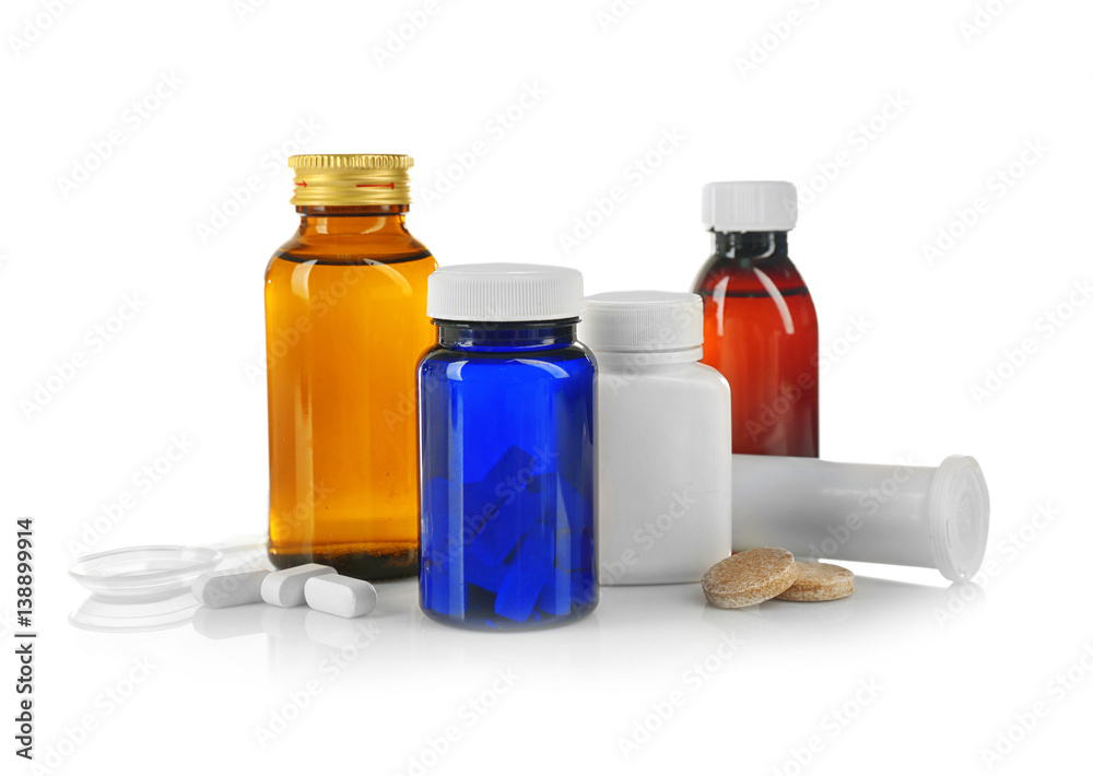 Bottles with cough syrup, pills and medicines isolated on white