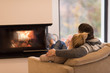 © .shock - Young couple  in front of fireplace