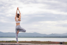 Asia Woman Doing Yoga Fitness Exercise