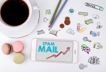 Wall Mural - Spam Mail, Business Concept. Mobile phone and coffee cup on a white office desk.
