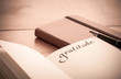 Notebook on Wooden Table - Gratitude Journal, Selective Focus, old fashioned look
