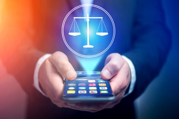 Poster - Businessman hand holding mobile phone with justice icon