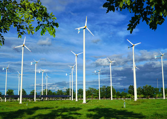 Wind turbine generating electricity on blue sky