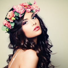 Wall Mural - Beautiful Model Woman with Perfect Makeup, Long Curly Hair and Wreath of Flowers