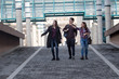 © Geza Farkas - Three students walking and smiling