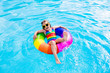 © famveldman - Child with toy ring in swimming pool