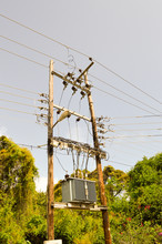 Electric Transformer On Wooden Pylons