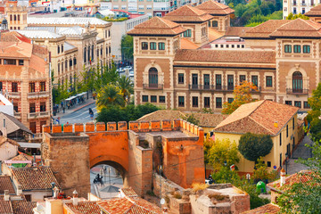 Wall Mural - View from the observation deck Mirador de la Lona of the old town, Triumphal Square and the city gate Puerta de Elvira, Granada, Andalusia, Spain