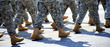 Army Military Soldiers Marching In A Parade Outdoors.