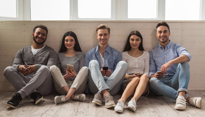 Wall Mural - Young people with gadgets