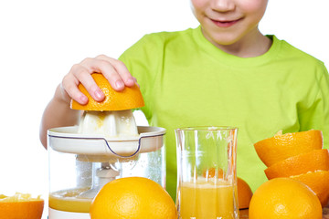 Wall Mural - Boy makes orange juice isolated