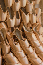 A Wall Of Stacked Pink Satin Ballet Slippers In London, England