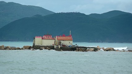 Wall Mural - Small Buddhist Temple on the Tiny Island of Hon Du in Vietnam