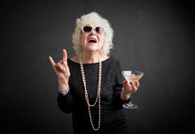 Cool Grandmother With Sunglasses And Drink In Hand